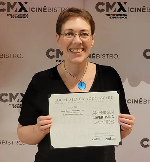 Karen holding the American Marketing Award she just won